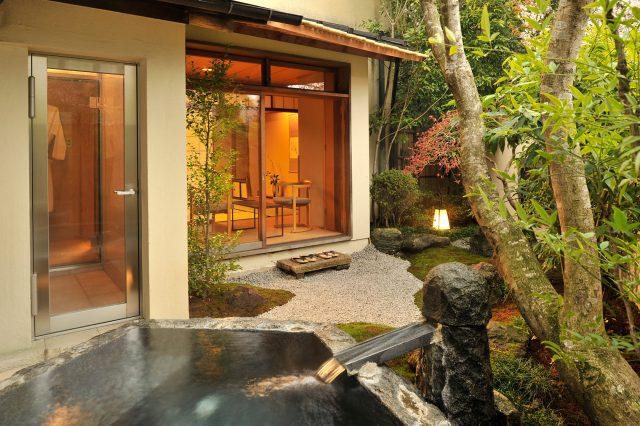 Private onsen bath with garden view at traditional ryokan Japan