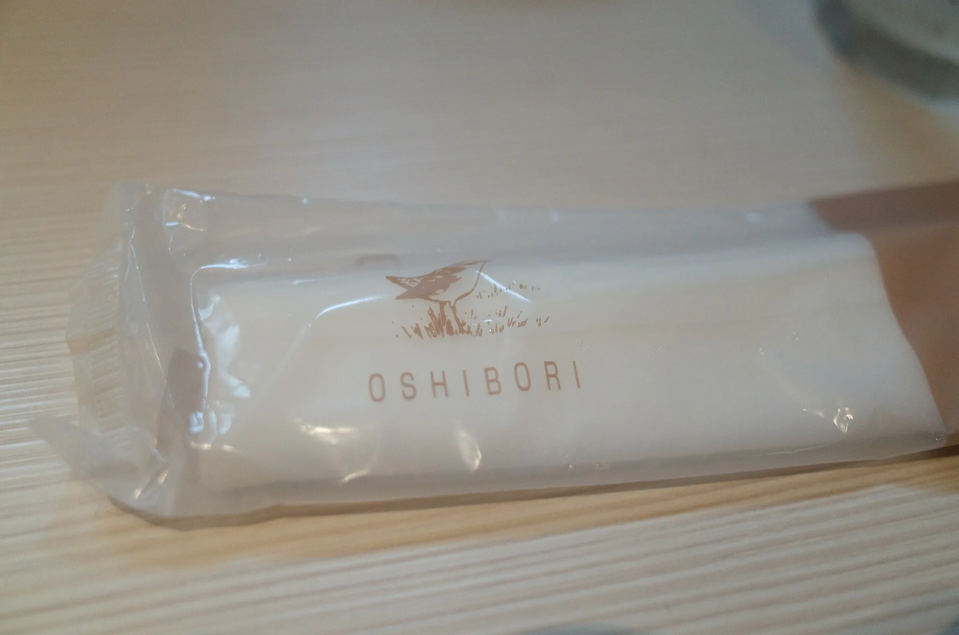 Rolled oshibori wet towel served at a Japanese restaurant